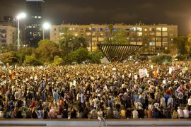 Israeli left wing activists gather for pro-peace rally and against military solution to the Israeli Palestinian conflict, in Tel Aviv, Israel, Saturday, Aug 16, 2014. (AP Photo/Oded Balilty)