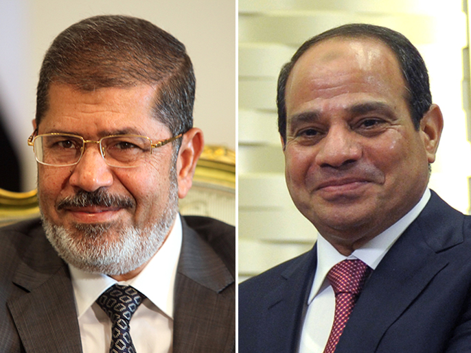 ‪(يمين)‬ مرسي (يسار) أول رئيس مدني منتخب بمصر أطيح بانقلاب وزير دفاعه السيسي(الأوروبية)