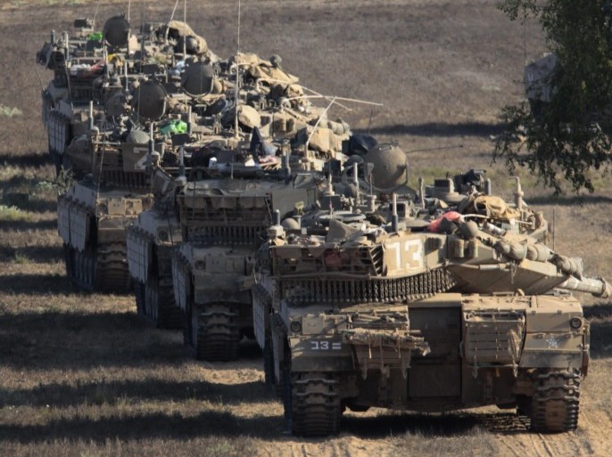 Israeli Merkava thanks lined up in a staging area inside southern Israel near to the Gaza Strip border, 03 August 2014. Israeli ground troops began withdrawing from the Gaza Strip as Israel wrapped up operations to destroy tunnels, but airstrikes continued. The Palestinian death toll rose to at least 1,719 since 08 July, including about 400 children, the Gaza Health Ministry said. At least 9,000 have been wounded, and rights groups have estimated that more than 10,000 houses were destroyed or badly damaged by Israel.