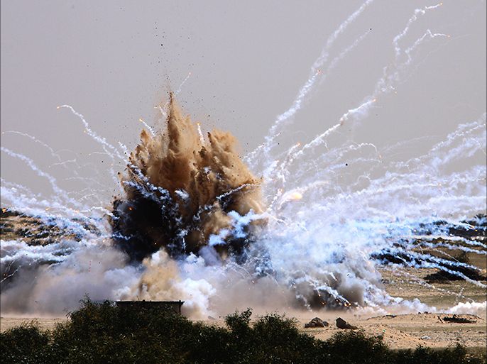 epa02088774 White phosphorous munitions are blown up by UN and Hamas sappers in Rafah town in the southern Gaza Strip, on 22 March 2010. United Nations officials have blown up white phosphorous munitions that remained unexploded since the Gaza war. EPA/MOHAMMED SABER