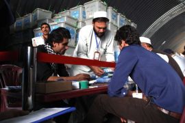 Independent Election Commission (IEC) workers recount ballots in Kabul, Afghanistan, 13 August 2014. The two rivals for the Afghan presidency signed a deal 08 August to form a national unity government, possibly bringing an end to more than four months of efforts to pick a new leader. Under the deal, the unity government would be formed regardless of whom is found to be the winner, a fact that will not be clear until an audit of 8.1 million votes is completed. The two candidates made the announcement at the residence of the UN Special Representative in Kabul during a visit by US Secretary of State John Kerry.