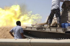 A tank belonging to the Western Shield, a branch of the Libya Shield forces, fires during a clash with rival militias around the former Libyan army camp, Camp 27, in the 27 district, west of Tripoli, August 22, 2014. REUTERS/Stringer (LIBYA - Tags: POLITICS CIVIL UNREST CONFLICT)
