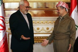 Iranian Foreign Minister Mohammad Javad Zarif (L) meets with Iraqi Kurdish leader Massud Barzani during their meeting on August 26, 2014 in Arbil, the capital of the Kurdish autonomous region of northern Iraq. Zarif is on a two-day visit to Iraq, as it fights a Sunni Arab insurgency led by Islamic State (IS) jihadists. AFP PHOTO / SAFIN HAMED