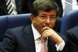 Turkey's Foreign Minister Ahmet Davutoglu attends a meeting at AK Party (AKP) headquarters in Ankara August 14, 2014. Turkish president-elect Tayyip Erdogan urged his ruling AK Party on Thursday to work for a stronger parliamentary majority next year to enable them to re-write the constitution, signalling no let-up in his drive to create an executive presidency. REUTERS/Umit Bektas (TURKEY - Tags: POLITICS)