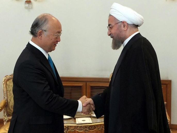 A handout picture made available by the Iranian Presidency on 17 August shows Iranian President Hassan Rowhani (R) greeting International Atomic Energy Agency (IAEA) Director General Yukiya Amano at the Iranian presidential office in Tehran, Iran, 17 August 2014. Amano is in Tehran for a one-day official visit to discuss Iran's nuclear program. EPA/IRANIAN PRESIDENCY / HANDOUT