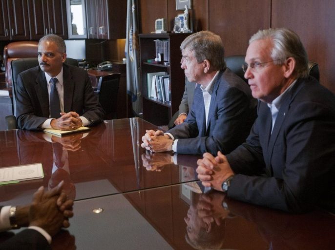 US Attorney General Eric Holder, left, during his meeting with Sen. Roy Blunt, R-Mo., center, Missouri Gov. Jay Nixon, right, and other elected officials at the US Attorney's office in St. Louis, Missouri, USA, 20 August 2014. Holder is traveling to Ferguson, Mo., to oversee the federal government's investigation into the shooting of 18-year-old Michael Brown by a police officer on 09 August. Holder promised a 'fair and thorough' investigation into the fatal shooting of a young blackman, Michael Brown, who was unarmed when a white police officer shot him multiple times.