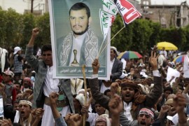 Supporters of the Shi'ite Houthi attend hold a poster of the group's leader Abdul-Malik al-Houthi during an anti-government rally in Sanaa August 29, 2014. Talks on forming a new Yemeni government collapsed on Sunday over demands by Shi'ite Muslim Houthis to restore fuel subsidies cut by President Abd-Rabbu Mansour Hadi. REUTERS/Khaled Abdullah (YEMEN - Tags: CIVIL UNREST POLITICS)