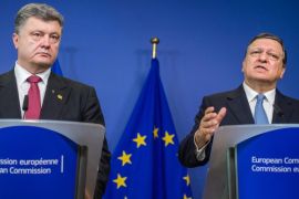 European Commission President Jose Manuel Barroso, right, and Ukraine's President Petro Poroshenko address the media after a meeting at the European Commission headquarters in Brussels on Saturday, Aug. 30, 2014. At a summit on Saturday EU leaders will discuss who will get the job as the 28-nation bloc's foreign policy chief for the next 5 years and the situation in Ukraine. (AP Photo/Geert Vanden Wijngaert)
