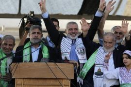 Hamas Gaza leader Ismail Haniyeh (3rd L) flashes a victory sign as he appears for the first time since the start of a seven-week conflict during a rally by Palestinians celebrating what they said was a victory over Israel, in Gaza City August 27, 2014. An open-ended ceasefire in the Gaza war held on Wednesday as Prime Minister Benjamin Netanyahu faced strong criticism in Israel over a costly conflict with Palestinian militants in which no clear victor emerged. REUTERS/Suhaib Salem (GAZA - Tags: POLITICS CIVIL UNREST CONFLICT)