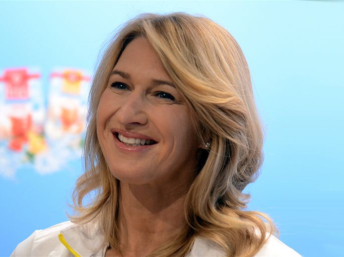 Former professional tennis player Steffi Graf poses at the tennis courts of Rochsuclub Duesseldorf, where she gave eight winners of a competition a tennis lesson, in Duesseldorf, Germany, 24 June 2013. EPA/HORST OSSINGER