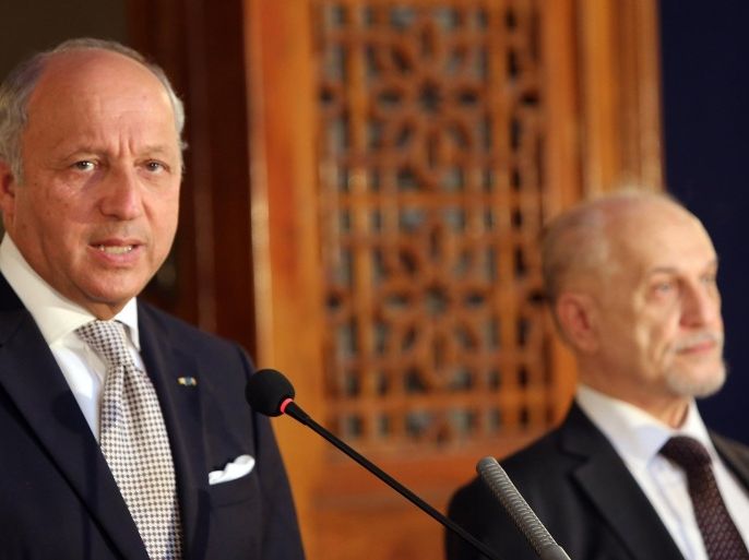 French Foreign Minister Laurent Fabius (L) speaks during a press conference with Iraqi deputy prime minister Hussein al-Shahristani in the capital Baghdad on August 10, 2014. US jets attacked jihadists who have besieged civilians on an Iraqi mountain for a week, as Britain and France joined a desperate race to save them from starvation. Fabius is due to oversee the first delivery of French aid for displaced people in the Sinjar area. AFP PHOTO / ALI AL-SAADI