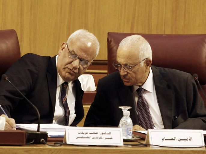 Palestinian chief negotiator Saeb Erekat (L) talks with Arab League Chief Nabil el-Araby during their meeting at the Arab League in Cairo August 11, 2014. Israel and the Palestinians began talks in Cairo on Monday to try and end the conflict in Gaza and lift the blockade on the coastal enclave, Egypt's state news agency MENA said. REUTERS/Asmaa Waguih (EGYPT - Tags: POLITICS CONFLICT CIVIL UNREST)