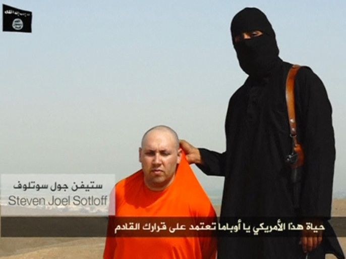 REUTERS IS UNABLE TO INDEPENDENTLY VERIFY THE CONTENT OF THIS VIDEO, WHICH HAS BEEN OBTAINED FROM A SOCIAL MEDIA WEBSITE. A masked Islamic State militant speaks next to a man purported to be U.S. journalist Steven Sotloff at an unknown location in this still image from an undated video posted on a social media website. Islamic State insurgents released the video on August 19, 2014 purportedly showing the beheading of U.S. journalist James Foley, who had gone missing in Syria nearly two years ago, and images of Sotloff whose life they said depended on U.S. action in Iraq. The video, titled "A Message to America," was released a day after Islamic State, an al Qaeda offshoot that has overrun large parts of Iraq, threatened to attack Americans "in any place." U.S. officials said they were working to determine its authenticity. REUTERS/Social Media Website via REUTERS TV ( Tags: CIVIL UNREST MEDIA) ATTENTION EDITORS - THIS PICTURE WAS PROVIDED BY A THIRD PARTY. REUTERS IS UNABLE TO INDEPENDENTLY VERIFY THE AUTHENTICITY, CONTENT, LOCATION OR DATE OF THIS IMAGE. FOR EDITORIAL USE ONLY. NOT FOR SALE FOR MARKETING OR ADVERTISING CAMPAIGNS. NO SALES. NO ARCHIVES. RECEIVED BY REUTERS, AS A SERVICE TO CLIENTS