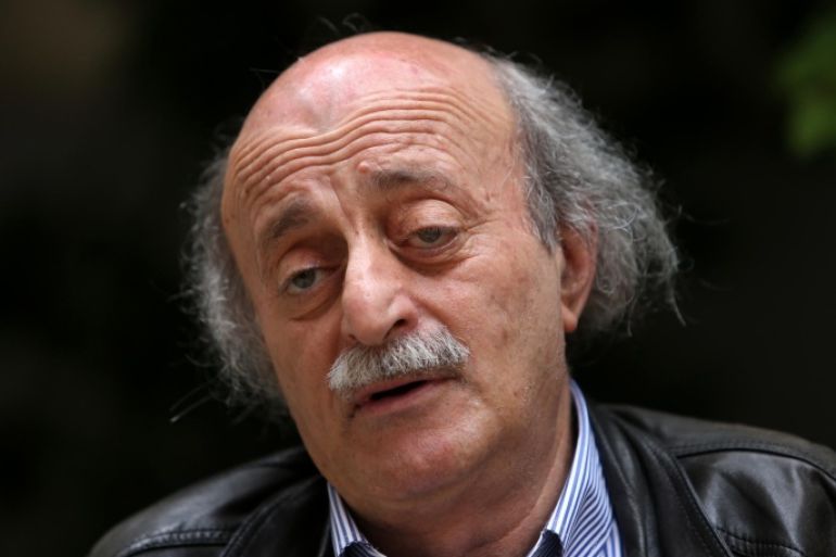 In this picture taken on May 28, 2014, Walid Jumblatt, the political leader of Lebanon's minority Druse sect, speaks during an interview with The Associated Press, as he sits in his garden house, in Beirut, Lebanon. The decision by Lebanon’s militant Hezbollah group to join the civil war in neighboring Syria and fight along President Bashar Assad's forces was a historical and moral “mistake” toward the Syrian people, a leading Lebanese politician, Jumblatt said. (AP Photo/Hussein Malla)
