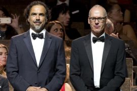 Director Alejandro Inarritu, left, and actor Michael Keaton arrive for the screening of the movie Birdman during the opening ceremony of the 71st edition of the Venice Film Festival in Venice, Italy, Wednesday, Aug. 27, 2014. (AP Photo/Andrew Medichini)