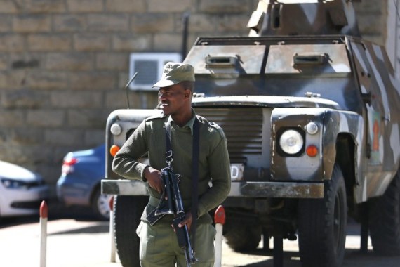 A member of the Lesotho military stands guard alongside an military vehicle in Maseru, Lesotho, 31 August 2014. A reported coup by the army occurred early Saturday morning when the army took control of the capital. EPA/STR SOUTH AFRICA OUT