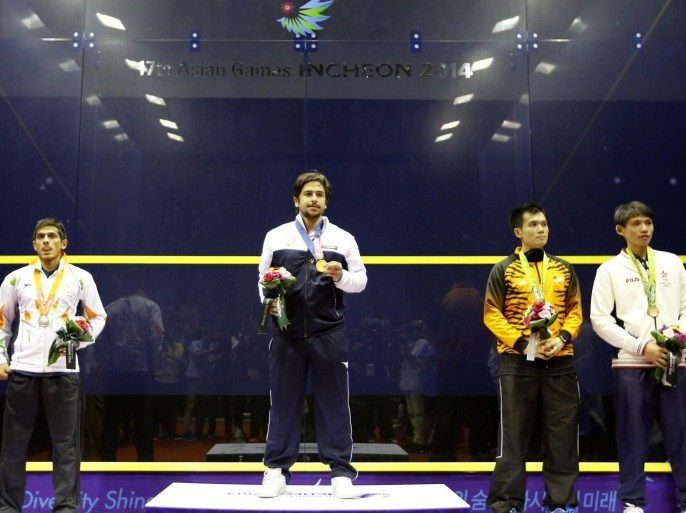 (L-R) Silver medal winner Ghosal Saurav of India, gold medal winner Abdullah Kh Kh H M Almezayen of Kuwait and bronze medal winners Ong Beng Hee of Malaysia and Lee Ho Yin of Hong Kong during the medal ceremony for the Squash Men's Single competition at Yeorumul Squash Courts at the 17th Incheon Asian Games in Incheon, South Korea, 23 September 2014. EPA/HOTLI SIMANJUNTAK