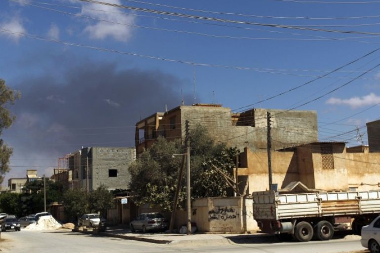 Smoke rises following an air strike in Libya's eastern coastal city of Benghazi on September 1, 2014. Libya's toothless outgoing government admitted from its safe refuge in the east of the country that it has in effect lost control of Tripoli to armed militias. AFP PHOTO/ ABDULLAH DOMA