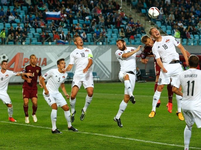 Liechtenstein team players defend their goal during the Euro 2016 qualifying soccer match against Russia at Arena Khimki stadium in Moscow, Russia, Monday, Sept. 8, 2014. (AP Photo/Pavel Golovkin)