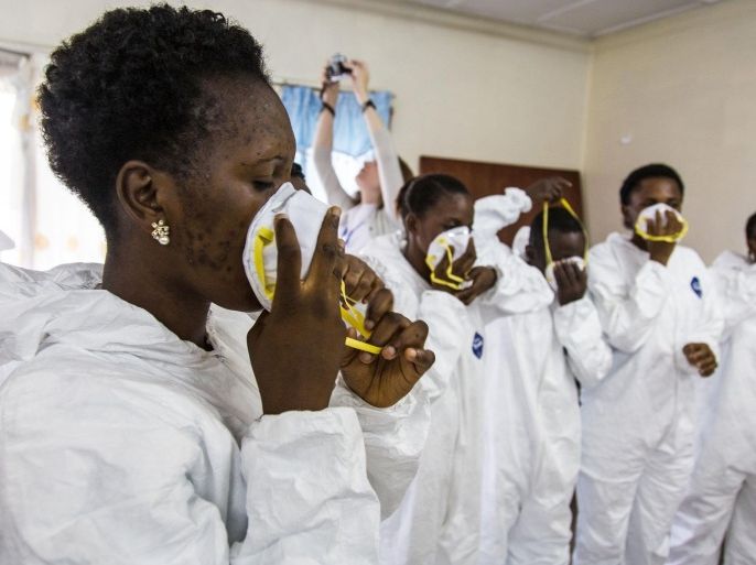 Nurses during training to use Ebola protective gear by World Health Organization, WHO, worker's, in Freetown, Sierra Leone, Thursday, Sept. 18, 2014. Shoppers crowded streets and markets in Sierra Leone's capital on Thursday stocking up for a three-day shutdown that authorities will hope will slow the spread of the Ebola outbreak that is accelerating across West Africa. (AP Photo/Michael Duff)