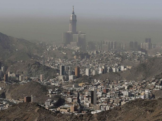 The four-faced Mecca Clock Tower is seen from the top of Mount Al-Noor, where Muslims believe Prophet Mohammad received the first words of the Koran through Gabriel in the Hera cave, during the annual Haj pilgrimage in Mecca September 30, 2014. REUTERS/Muhammad Hamed (SAUDI ARABIA - Tags: RELIGION CITYSCAPE)
