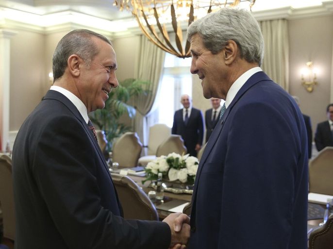 U.S. Secretary of State John Kerry (R) and Turkey's President Tayyip Erdogan talk at the beginning of a meeting in Ankara September 12, 2014. REUTERS/Kayhan Ozer/Presidential Press Office/Handout via Reuters (TURKEY - Tags: POLITICS MILITARY) ATTENTION EDITORS - THIS PICTURE WAS PROVIDED BY A THIRD PARTY. REUTERS IS UNABLE TO INDEPENDENTLY VERIFY THE AUTHENTICITY, CONTENT, LOCATION OR DATE OF THIS IMAGE. FOR EDITORIAL USE ONLY. NOT FOR SALE FOR MARKETING OR ADVERTISING CAMPAIGNS. THIS PICTURE IS DISTRIBUTED EXACTLY AS RECEIVED BY REUTERS, AS A SERVICE TO CLIENTS. NO SALES. NO ARCHIVES
