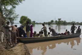 Pakistani soldiers use a boat to rescue residents affected by flooding in Sher Shah, a town in Multan District in Punjab province, on September 13, 2014. The floods began in Kashmir after heavy monsoon rains and are now progressing downstream through Pakistan, inundating thousands of villages and large areas of important farmland in the country's breadbasket. The floods and landslides from days of heavy monsoon rains have now claimed at least 480 lives in Pakistan and India, with rescuers struggling to cope with the massive disaster. AFP PHOTO/ Arif ALI