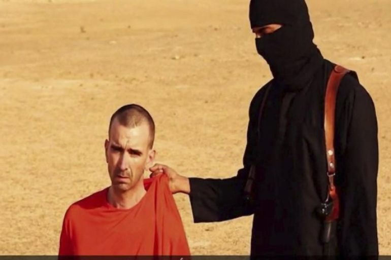A frame from a video released by the Islamic State on 02 September 2014 purportedly shows British journalist David Cawthorne Haines (L) being threatened at the time of the execution by beheading of American journalist Steven Sotloff, somewhere in a desert setting. A video released by the Islamic State (IS) on 14 September 2014 purportedly shows Islamic militants executing British journalist David Haines, who was kidnapped in March 2013 in Syria. EPA/ISLAMIC STATE VIDEO / HANDOUT