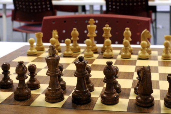FILE - In this file photo taken August, 1, 2014, showing a chess board at the Chess Olympiad Norway 2014 in Tromsoe, Norway. The major international chess tournament in northern Norway ended Thursday Aug. 14, 2014, on a grim note, with one player dying in the middle of a game and another found dead in a hotel room. Organizers say a 67-year-old member of the Seychelles team collapsed and died during the final round, and another player from Uzbekistan, was found dead in a hotel room later Thursday. (AP Photo / Rune Stoltz Bertinussen, NTB scanpix, FILE)