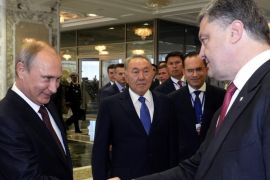 (FILE) A file photo dated 26 August 2014 of Russian President Vladimir Putin (2-L) shaking hands with Ukrainian President Petro Poroshenko (R) as Kazakh President Nursultan Nazarbayev (C) looks at them prior their talks in Minsk, Belarus. Media reports on 03 September 2014 state that the presidents of Ukraine and Russia, Petro Poroshenko and Vladimir Putin, agreed on a permanent ceasefire, according to Poroshenko's office. The agreement was reportedly reached during a telephone conversation.