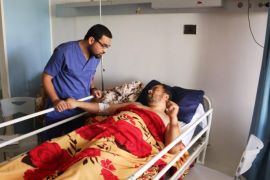 A man lies in a bed at Sbaah hospital, after he was injured in a shelling in Qaser Bin Ghashir, near the Tripoli International Airport July 26, 2014. REUTERS/Hani Amara (LIBYA - Tags: POLITICS CIVIL UNREST)
