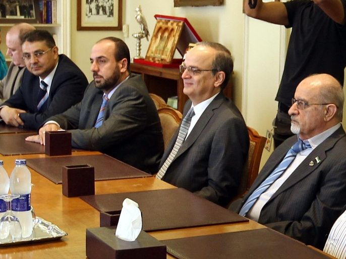 Member of Syrian National Coalition Haitham Al-Maleh (R), Chief negotiator of the Syrian National Coalition Hadi al-Bahra (2-R) and Secretary-General of the Syrian National Coalition Nasr al-Hariri (3-R) meet with Arab League Secretary General Nabil al-Arabi (not picture) in Cairo, Egypt, 08 September 2014