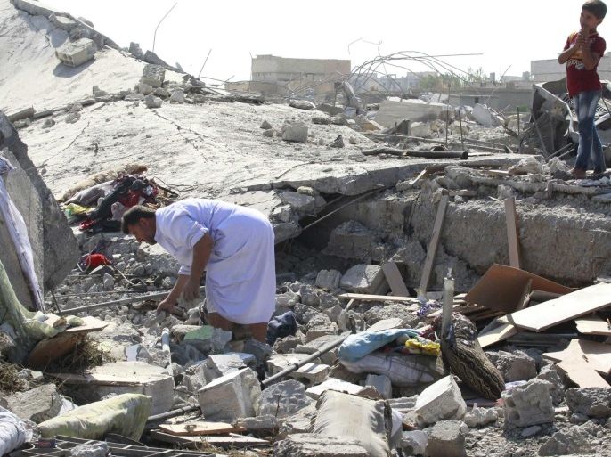 A man looks through the debris of a destroyed building after a Syrian war plane crashed in Raqqa, in northeast Syria September 16, 2014. Islamic State fighters shot down the Syrian war plane using anti-aircraft guns on Tuesday, the first time the group has downed a military jet since declaring its cross-border caliphate in June, a group monitoring the civil war said. REUTERS/Stringer (SYRIA - Tags: CIVIL UNREST POLITICS CONFLICT TRANSPORT MILITARY)