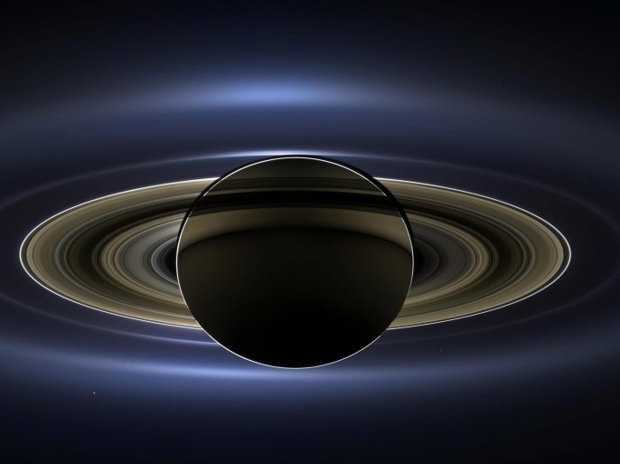 A handout photo provided by NASA on 12 November 2013 shows the planet Saturn taken by the NASA's 'Cassini' spacecraft on 19 July 2013 when it slipped into Saturn's shadow and turned to image the planet, seven of its moons, its inner rings - and, in the background, our home planet, Earth. With the sun's powerful and potentially damaging rays eclipsed by Saturn itself, Cassini's onboard cameras were able to take advantage of this unique viewing geometry. They acquired a panoramic mosaic of the Saturn system that allows scientists to see details in the rings and throughout the system as they are backlit by the sun. This mosaic is special as it marks the third time our home planet was imaged from the outer solar system; the second time it was imaged by Cassini from Saturn's orbit; and the first time ever that inhabitants of Earth were made aware in advance that their photo would be taken from such a great distance. With both Cassini's wide-angle and narrow-angle cameras aimed at Saturn, Cassini was able to capture 323 images in just over four hours. This final mosaic uses 141 of those wide-angle images. Images taken using the red, green and blue spectral filters of the wide-angle camera were combined and mosaicked together to create this natural-color view. The image shown is a brightened version with contrast and color enhanced, NASA explains in its accompanying press release. EPA/NASA/JPL-Caltech/SSI / HANDOUT