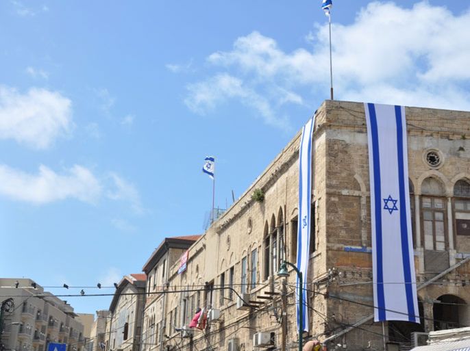 رفع العلم الإسرائيلي بشهر ابريل – نيسان 2013 على عقارات للاجئين الفلسطينيين في مدينة يافا تمهيدا لبيعها لليهود بالمزاد العلني