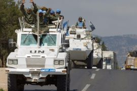 UN troops wave from their vehicles as they leave Syria and cross into Israel, from the northern part of the Israeli-Syrian border, near the Syrian village of Jubata Al Khashab, in the Golan Heights, 15 September 2014. A UN Military Police Officer confirmed that troops of the UN Disengagement Observer Force (UNDOF) were withdrawing from the Syrian part of the Golan Heights due to security reasons. The UNDOF is monitoring a 1974 ceasefire agreement between Israel and Syria on the Golan Heights.