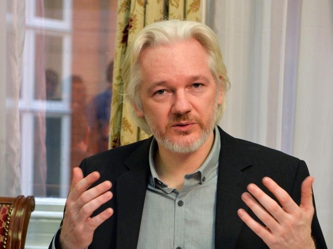 WikiLeaks founder Julian Assange speaks during a press conference inside the Ecuadorian Embassy in London, where he confirmed he "will be leaving the embassy soon", Monday Aug. 18, 2014. The Australian Assange fled to the Ecuadorian Embassy in 2012 to escape extradition to Sweden, where he is wanted over allegations of sex crimes. (AP Photo / John Stillwell, POOL)