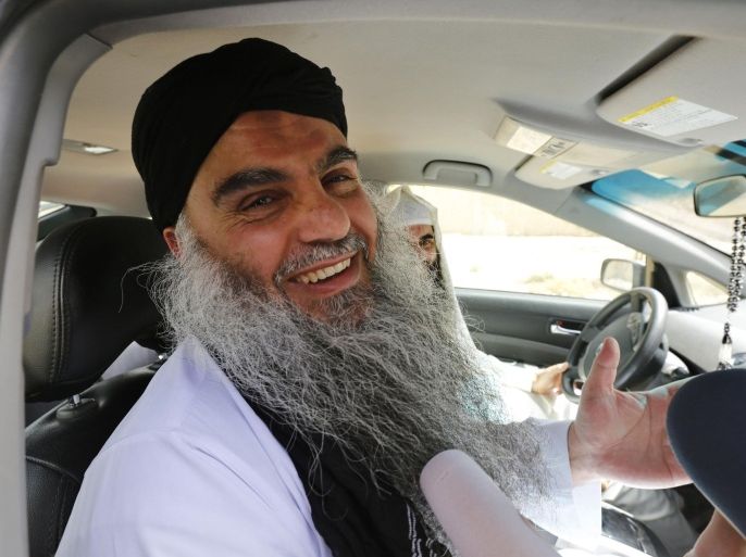 Radical Muslim cleric Abu Qatada speaks to the media after his release from Mwaqar 2 prison near Amman September 24, 2014. A Jordanian court acquitted Abu Qatada on Wednesday of charges of providing spiritual and material support for a plot to attack tourists during Jordan's New Year celebrations in 2000, a judicial source said. REUTERS/Muhammad Hamed (JORDAN - Tags: POLITICS RELIGION CRIME LAW)