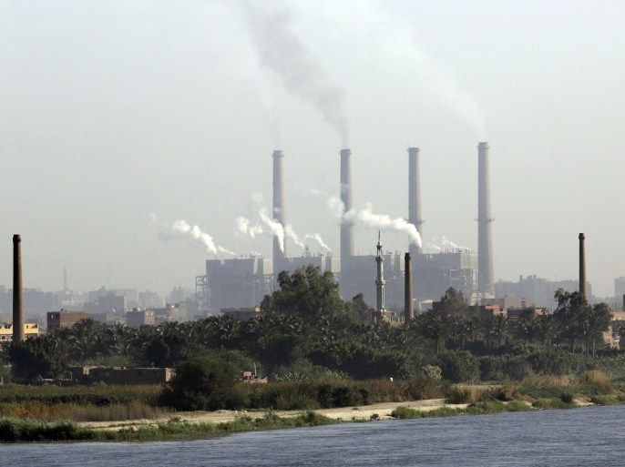In this Monday, April 28, 2014 photo, smoke billows from the Shoubra El-Kheima power station, which is owned by the North Cairo electricity distribution company, on the Nile river in Cairo, Egypt. Rolling blackouts have already been hitting neighborhoods of Cairo daily throughout the winter, when electricity usage is lower. Now summer’s heat is coming, and Egypt’s crippling energy crisis is threatening to mount, creating an immediate political liability for the new president to be elected next month, expected to be former army chief Abdel-Fattah el-Sissi.(AP Photo/Amr Nabil)