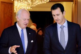 In this photo released by the Syrian official news agency SANA, United Nations special envoy to Syria Staffan de Mistura, left, speaks with Syrian President Bashar Assad in Damascus, Syria, Thursday, Sept. 11, 2014. The new U.N. envoy to Syria said “the top priority now is to fight terrorism.” Speaking on his first visit to Damascus following a meeting with Assad on Thursday, Mistura said he will strive “with a renewed energy” to move toward a political settlement to the Syrian conflict. (AP Photo/SANA)