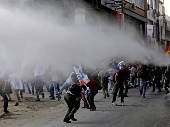 Turkish riot police use water cannon to disperse protesters during a demonstration after an elevator accident near a construction site in Istanbul, Turkey, 07 September 2014. At least 10 workers were killed during the construction of a 36-storey building in Istanbul when the elevator plummeted from one of the top floors, local media reported on 06 September. Istanbul, the largest city in Turkey, is experiencing a construction boom.