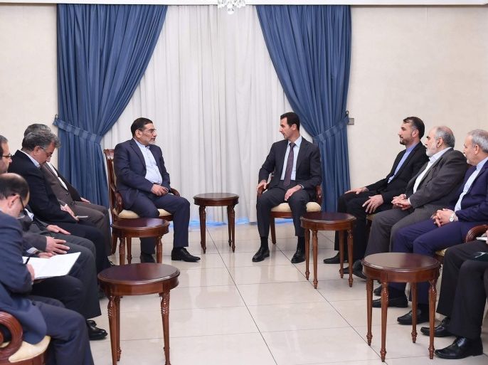 Syria's President Bashar al-Assad (centre R) meets Admiral Ali Shamkhani (center L), Iran�s Supreme National Security Council Director, in Damascus September 30, 2014, in this picture released by Syria's national news agency SANA. REUTERS/SANA/Handout via Reuters (SYRIA - Tags: POLITICS) ATTENTION EDITORS - THIS PICTURE WAS PROVIDED BY A THIRD PARTY. REUTERS IS UNABLE TO INDEPENDENTLY VERIFY THE AUTHENTICITY, CONTENT, LOCATION OR DATE OF THIS IMAGE. FOR EDITORIAL USE ONLY. NOT FOR SALE FOR MARKETING OR ADVERTISING CAMPAIGNS. THIS PICTURE IS DISTRIBUTED EXACTLY AS RECEIVED BY REUTERS, AS A SERVICE TO CLIENTS