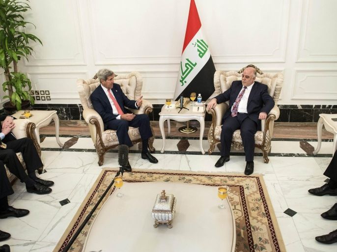U.S. Secretary of State John Kerry, center left, speaks to new Iraqi Prime Minister Haider al-Abadi, center right, during a meeting in Baghdad, Iraq, Wednesday, Sept. 10, 2014. Kerry is traveling to the mideast this week to discuss ways to bolster the stability of the new Iraqi government and combat the Islamic State militant group that has taken over large swaths of Iraq and Syria. (AP Photo/Brendan Smialowski, Pool)