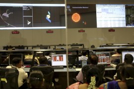 Indian Space Research Organisation scientists watch screens display the graphics explaining Mars Orbiter Mission at their Telemetry, Tracking and Command Network complex in Bangalore, India, Wednesday, Sept. 24, 2014. India triumphed in its first interplanetary mission, placing a satellite into orbit around Mars on Wednesday morning and catapulting the country into an elite club of deep-space explorers. (AP Photo/Aijaz Rahi)