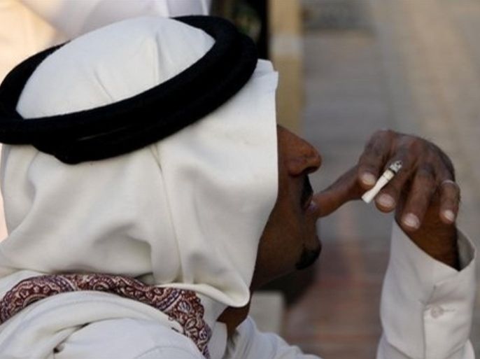 A Saudi smokes on the street in Riyadh, Saudi Arabia, Tuesday, Nov. 11, 2008. The Saudi health minister says his government has filed a $34 billion lawsuit against importers of cigarettes from international tobacco companies, including U.S. companies. Hamad al-Manie told the Associated Press the government wants compensation for the cost of treating illnesses caused by smoking in the Kingdom. Al-Manie on Tuesday put the health and economic costs of smoking-related illnesses at the equivalent of about $1.3 billion a year.