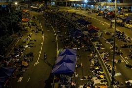 HONG KONG - OCTOBER 06: A general view as pro-democracy protesters sleep on the streets outside the Hong Kong Government complex on October 6, 2014 in Hong Kong, Hong Kong. Thousands of pro democracy supporters continue to occupy the streets surrounding Hong Kong's Financial district. The protesters are calling for open elections and the resignation of Hong Kong's Chief Executive Leung Chun-ying.
