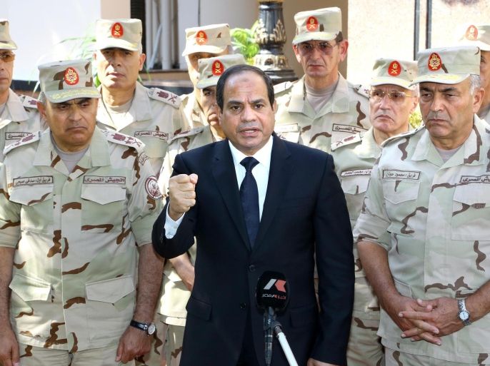 CAIRO, EGYPT - OCTOBER 25: Egyptian President Abdel-Fattah El-Sisi (C) gives a speech during the press release following the meeting of the National Defence Council after the Sinai attacks. At least 30 soldiers were killed in attacks.