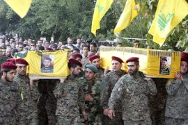 Lebanon's Hezbollah members carry the coffins of two of their comrades, who were killed in clashes with fighters from the Nusra Front in eastern Lebanon, during their funeral in Baalbek, in the Bekaa valley October 6, 2014. Ten fighters from Lebanon's Shi'ite Hezbollah group were killed in clashes with fighters from al-Qaeda's Syrian wing in eastern Lebanon on Sunday, a source close to the group said on Monday. The Qaeda fighters, who see Hezbollah as among their chief foes, attacked a large area stretching from south of the town of Baalbek up to areas close to the border town of Arsal. REUTERS/Ahmad Shalha (LEBANON - Tags: POLITICS CIVIL UNREST)