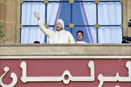 King Mohammed VI of Morocco waves after he delivered a speech before both houses of the parliament at the opening of the first session of the fourth legislative year of the 9th legislature, in Rabat on October 10, 2014