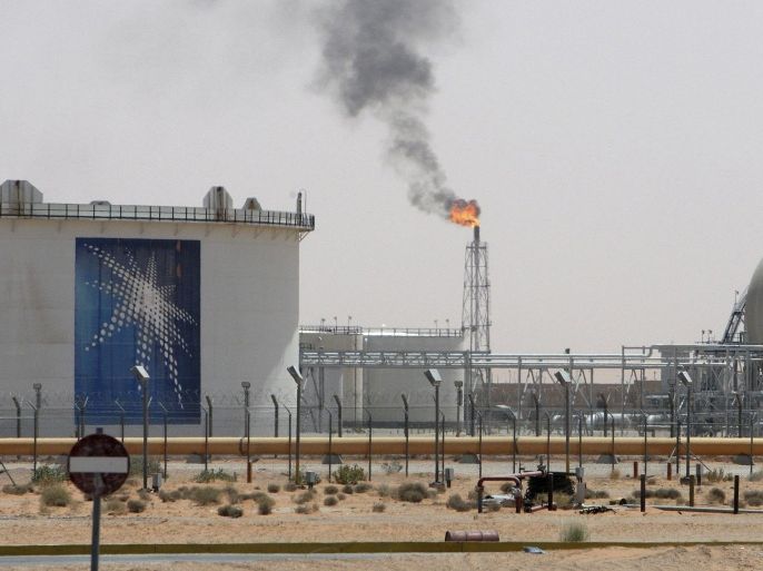A gas flame is seen in the desert near the Khurais oilfield, about 160 km (99 miles) from Riyadh, in this June 23, 2008 file photo. A combination of massive currency reserves and a 2013 spending plan based on a conservative oil price projection means Saudi Arabia has considerable flexibility in deciding its oil output policy this year. To story SAUDI-OIL/BUDGET REUTERS/Ali Jarekji/Files (SAUDI ARABIA - Tags: BUSINESS ENERGY)